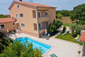 Family friendly apartments with a swimming pool Vinkuran, Pula - 7444